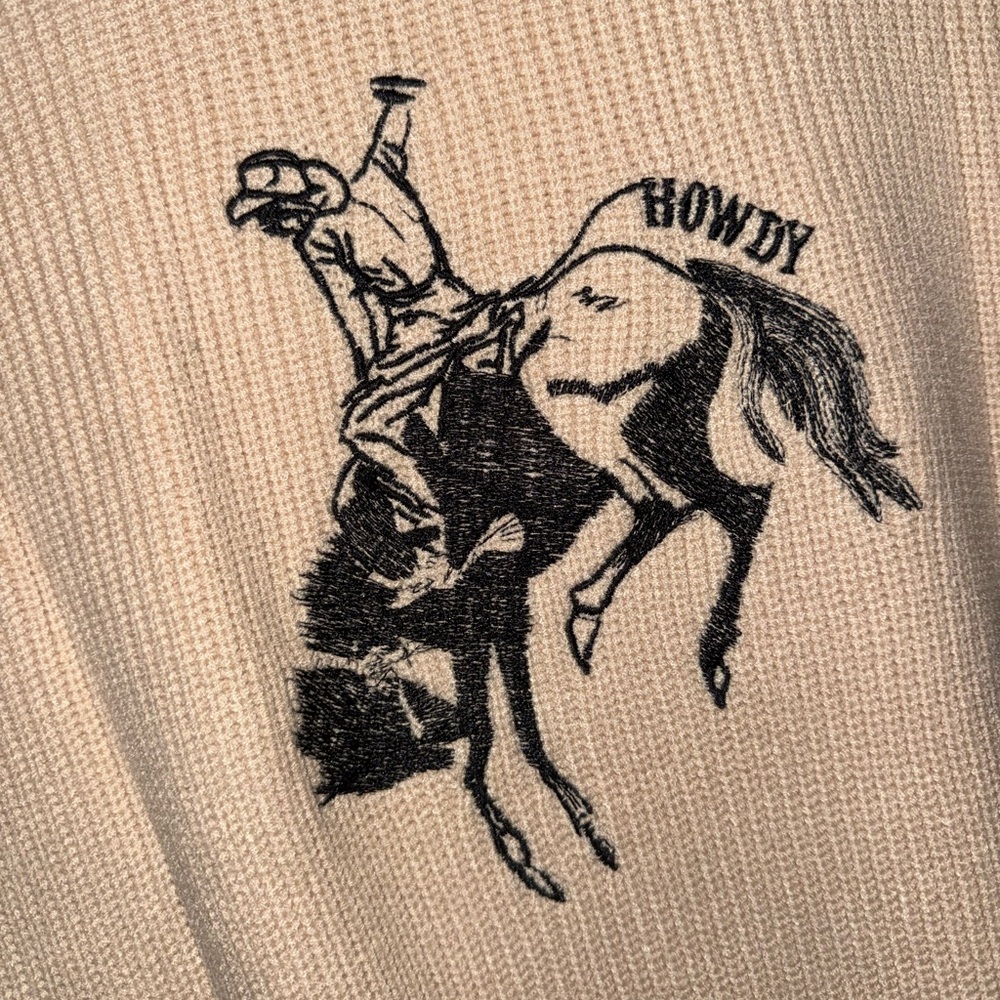 Women’s Cream Sleeveless Sweater with Cowboy Graphic - Picture 2 of 2